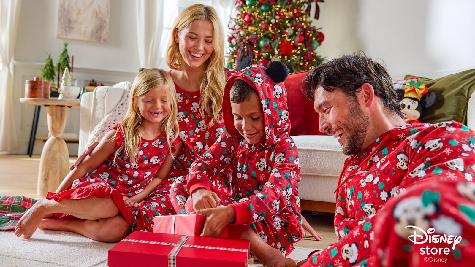 Family in red Mickey Mouse pajamas