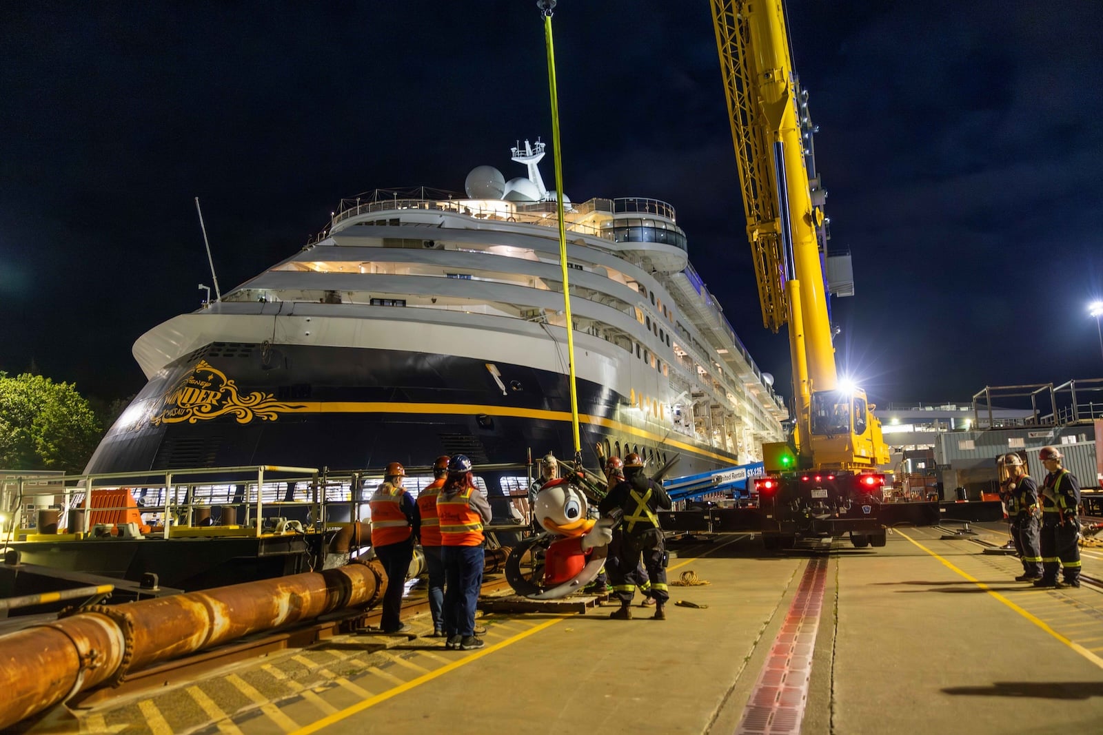 Workers performing maintenance on cruise ship
