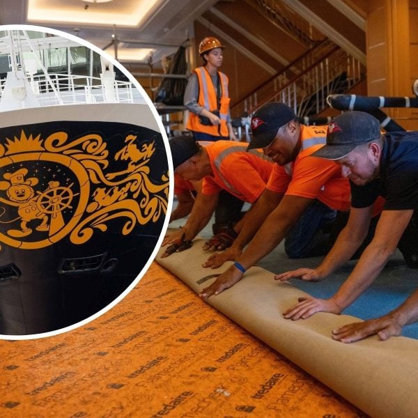 Workers performing maintenance on cruise ship