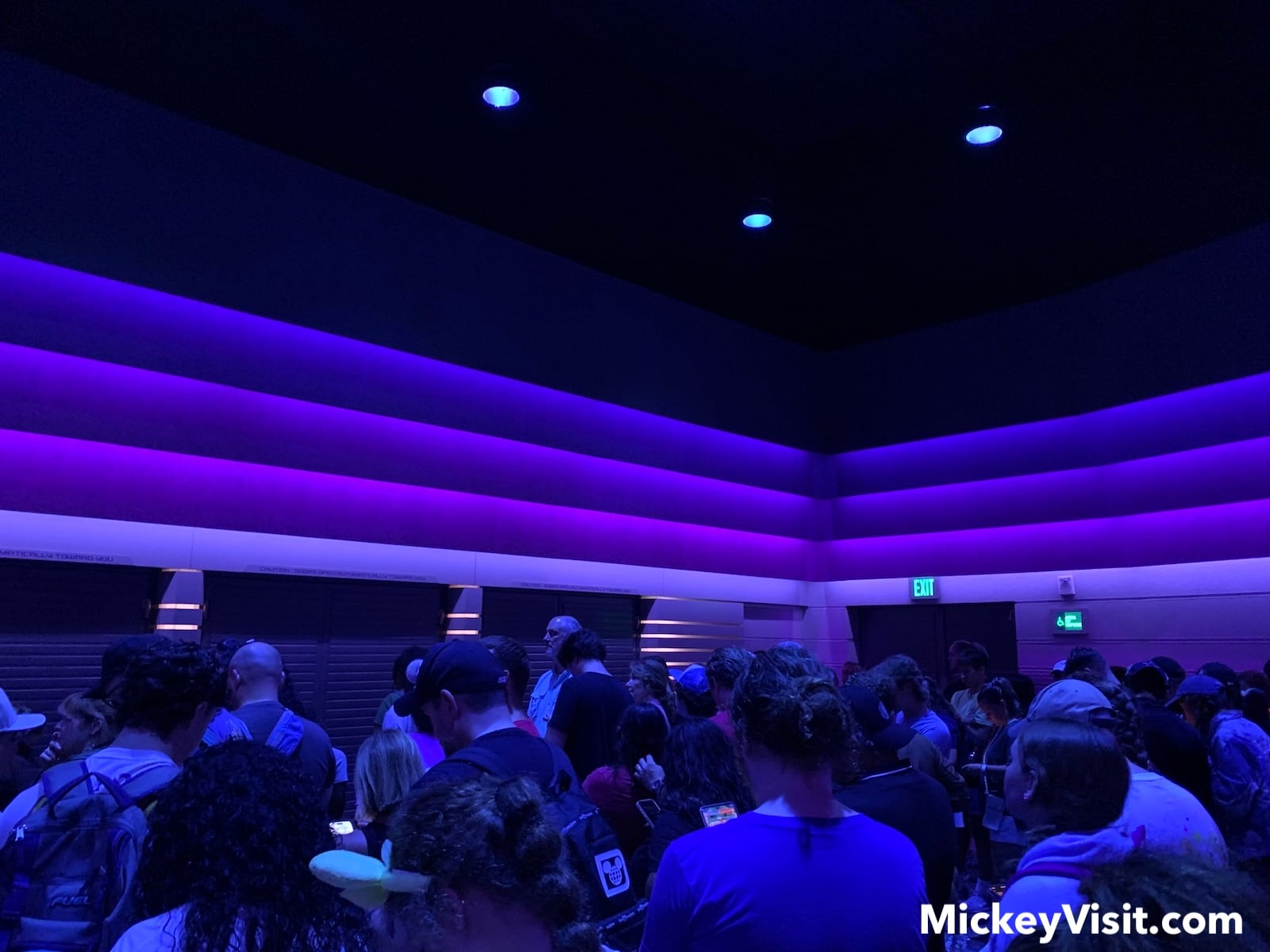 Crowded room with purple walls