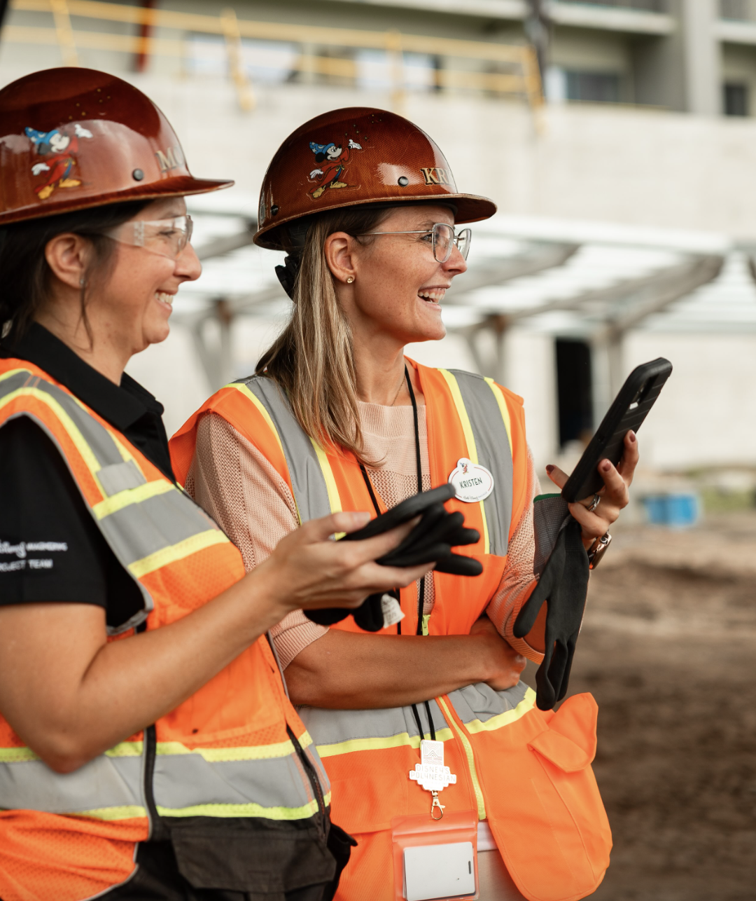 Women wearing hard hats and construction vests
