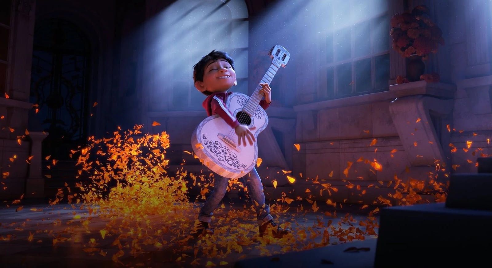 Miguel strumming guitar