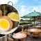 Scotch egg with table seating by lake