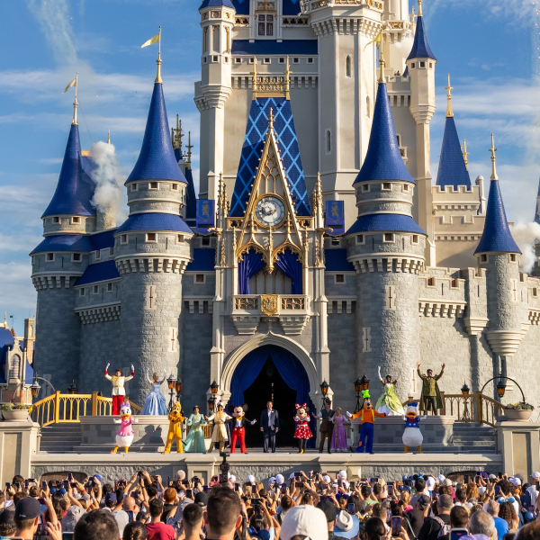 Cinderella Castle with Disney characters and crowd