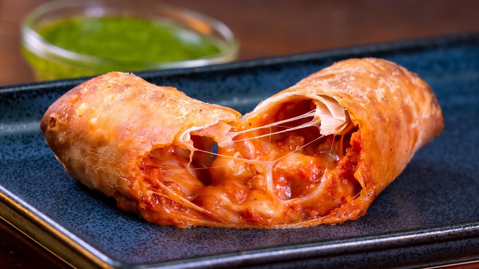 Pepperoni Pizza Egg Roll with pesto dipping sauce at Bountiful Valley Brews